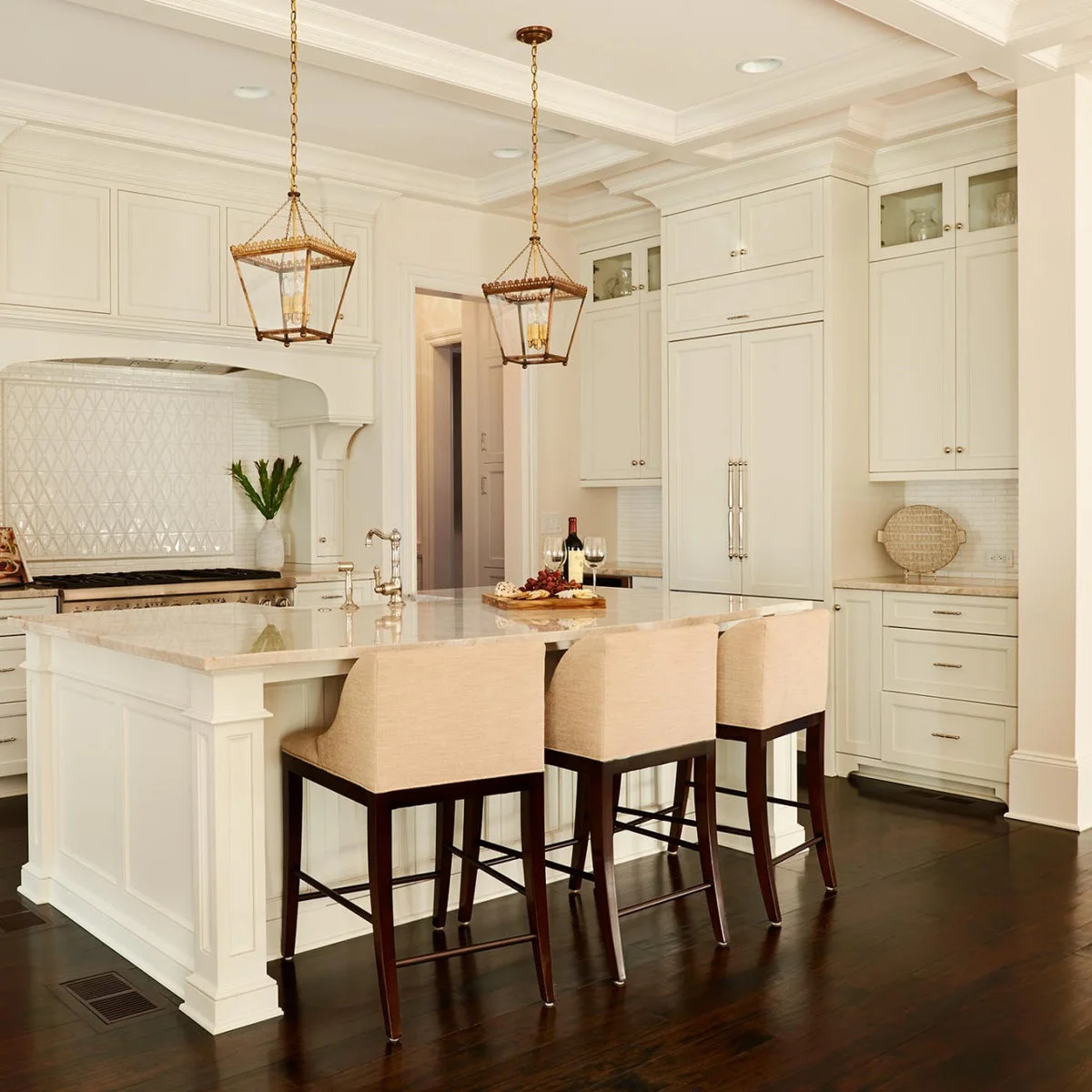 A white paneled refrigerator is topped by a broad horizontal section and paired upper cupboard doors.