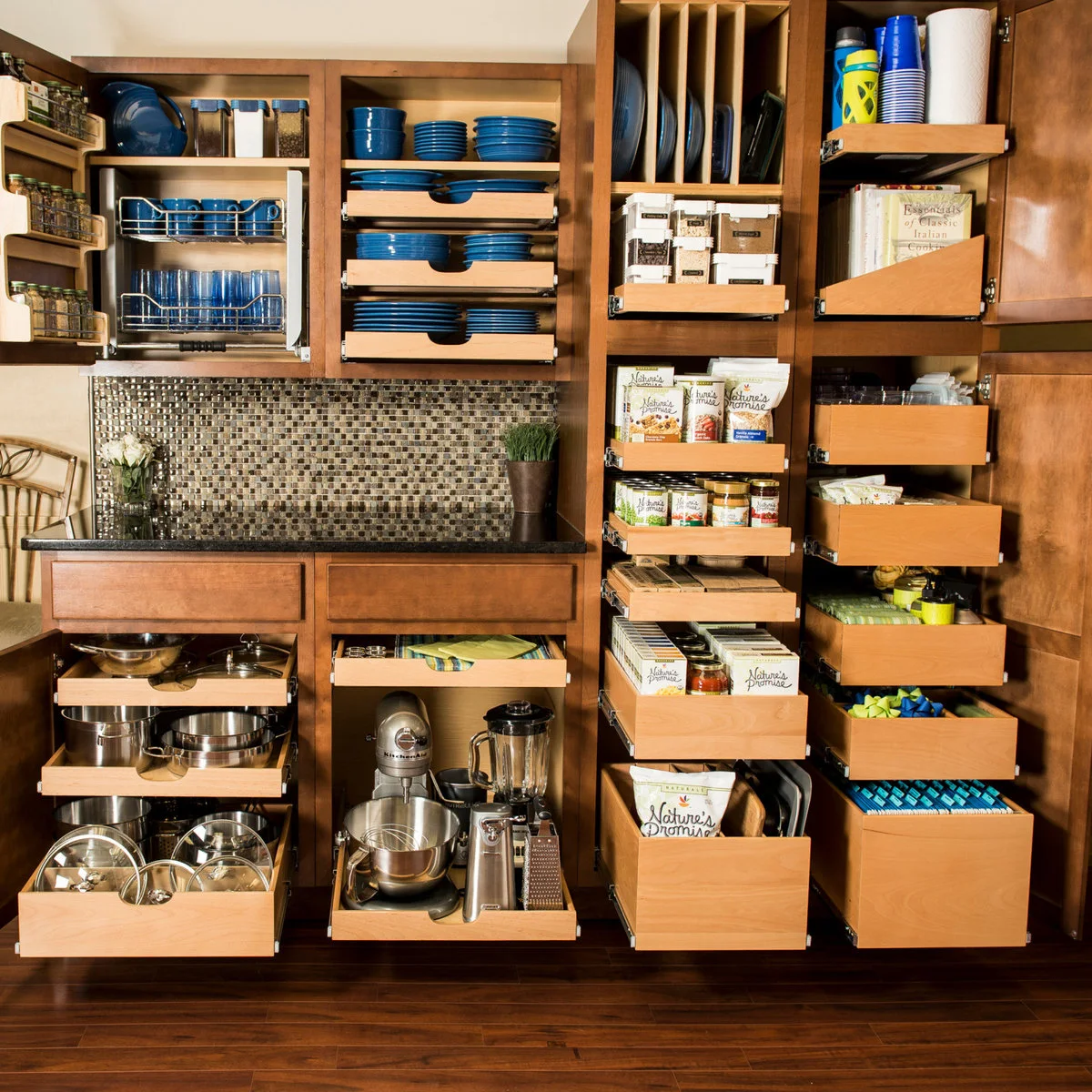 Wood pantry and kitchen storage with pull-out shelves for food, dishes and appliances