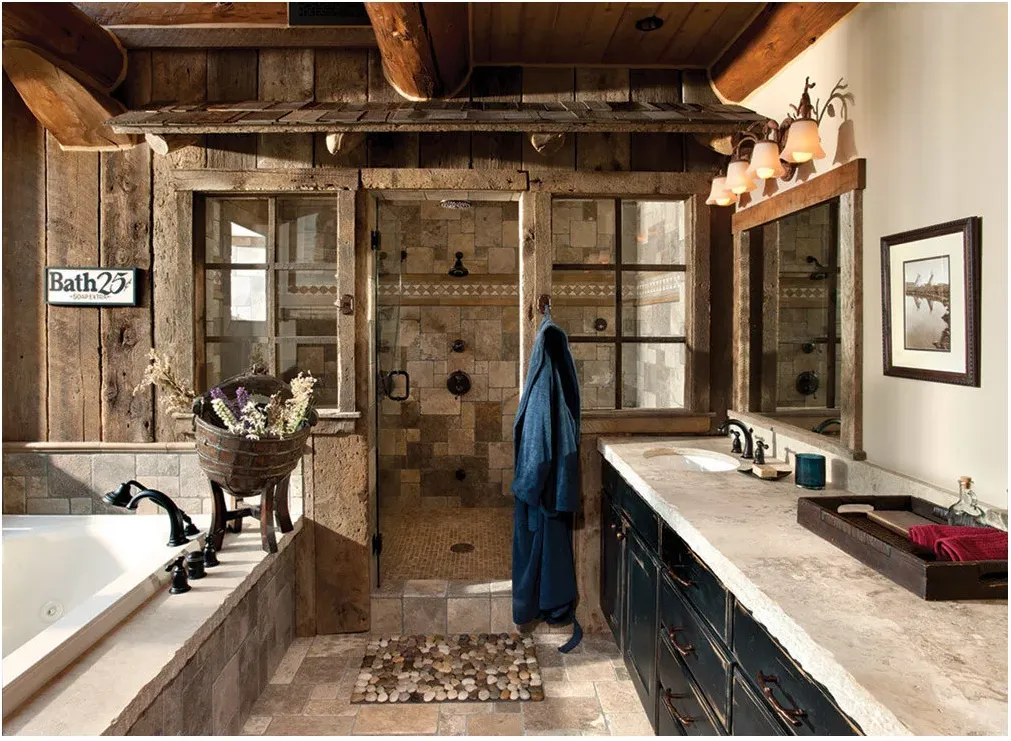 A shower with warm square tiles and a patterned border framed by weathered wood and window-like side panels in a log-style bathroom.
