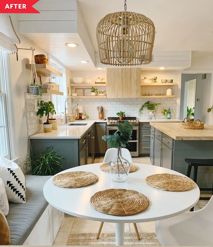 Boho kitchen with sage-gray cabinets, rattan pendant lighting, a pale wooden island and round dining table
