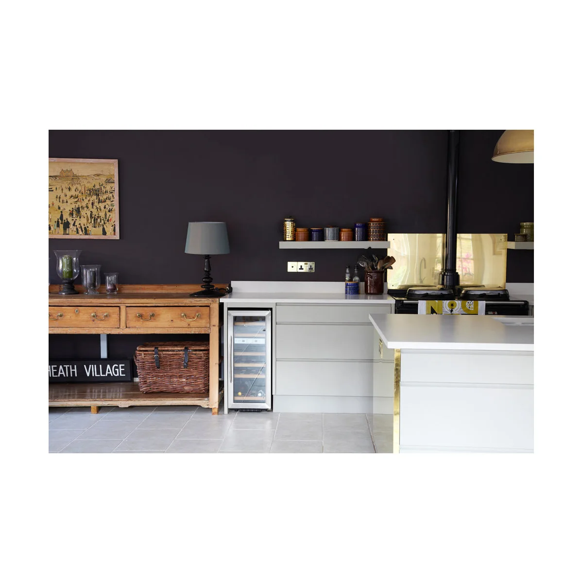 Victorian terrace kitchen with dark plum walls, a wood-colored console and pale fitted drawers