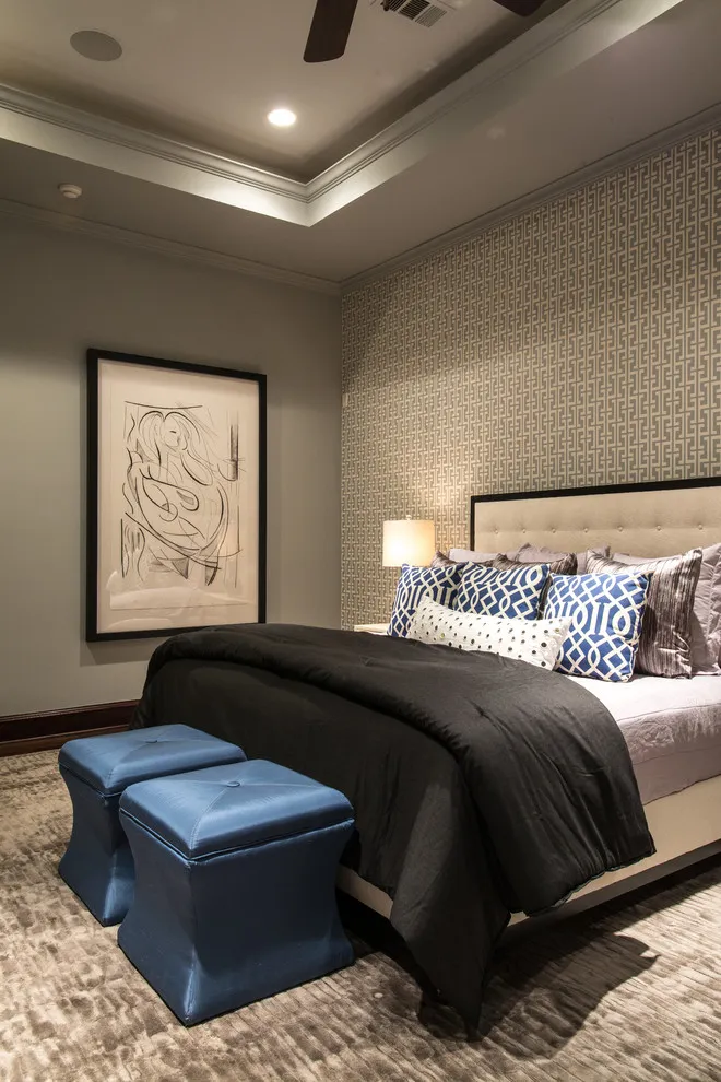 A fine dark patterned wall sits behind a pale headboard and black bedding