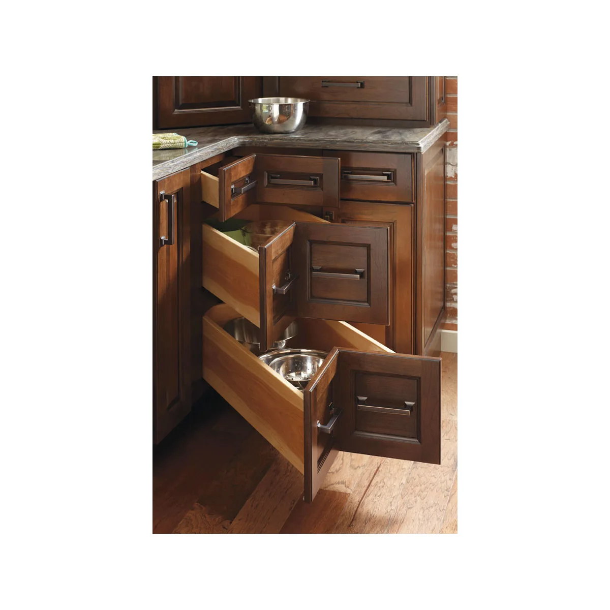 Dark wooden kitchen corner with shallow and deep angled drawers open