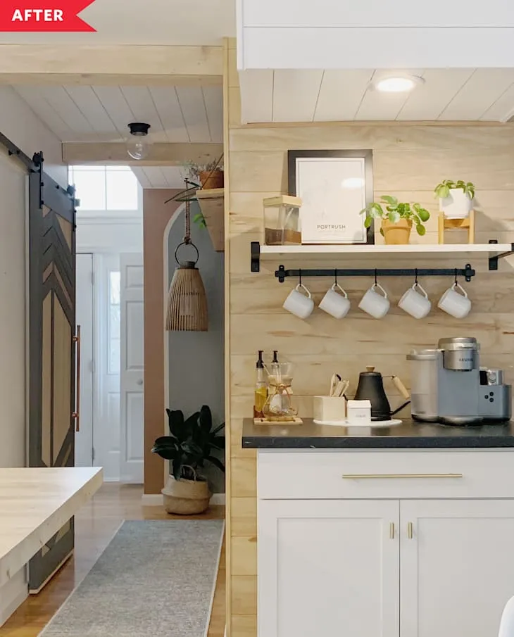 Practical coffee station with open shelf, hanging mugs and slim wood-paneled wall