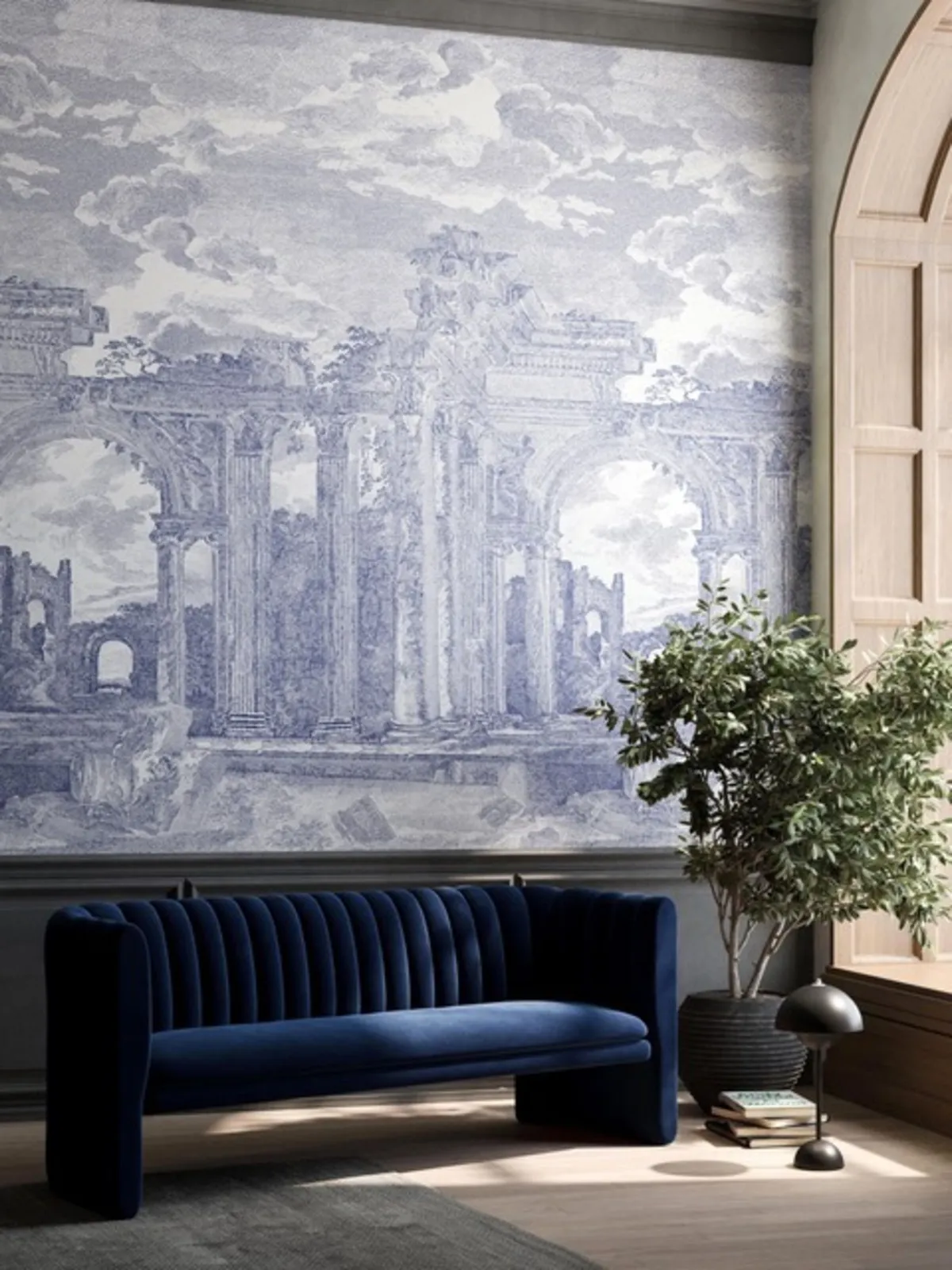 A broad blue-gray scenic wall stands behind a dark upholstered bench and pale architectural details.
