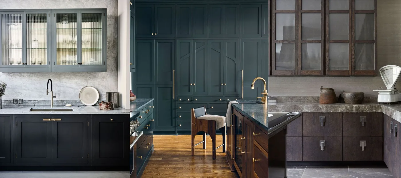 Kitchen with deep teal full-height cupboards, dark lower units, wood-framed glazed wall cabinets, gray veined counters, metal handles, and wood floor.