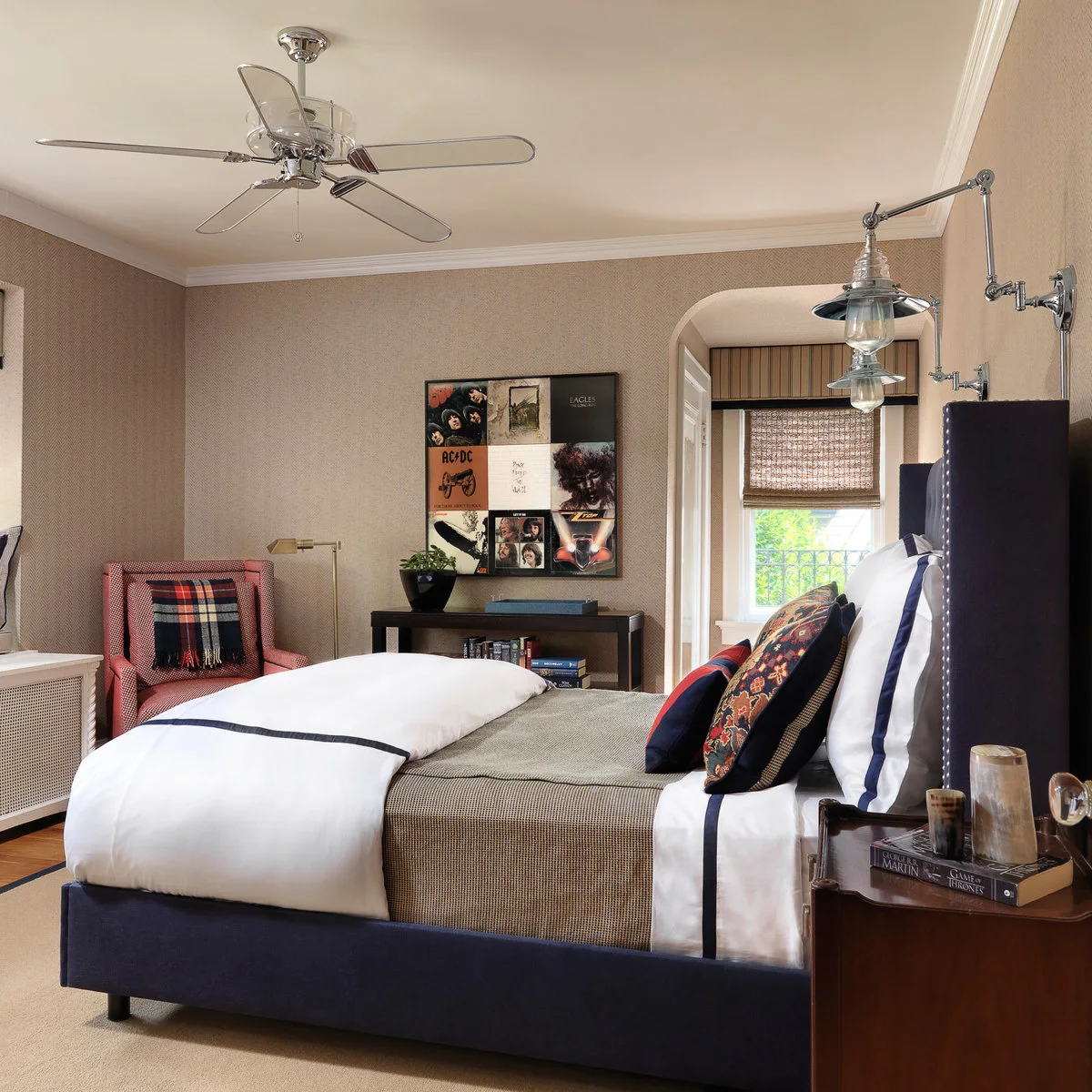 Teen bedroom with framed album-cover artwork, a checked chair and dark upholstered bed