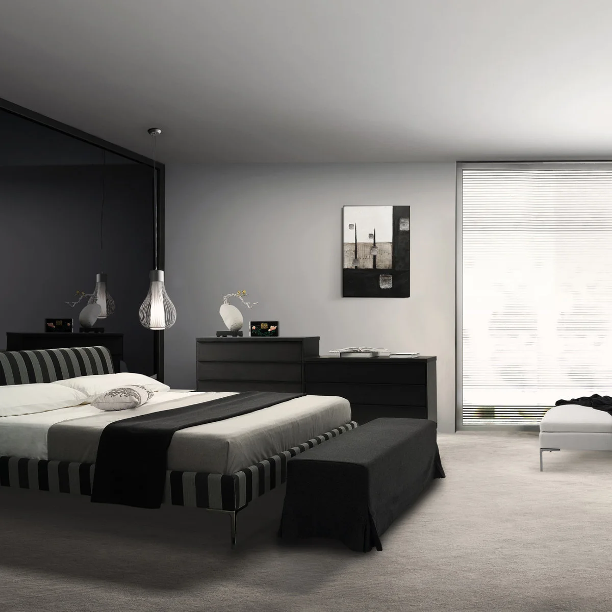 Grey bedroom with dark striped bed upholstery, low black cabinets and pale carpet