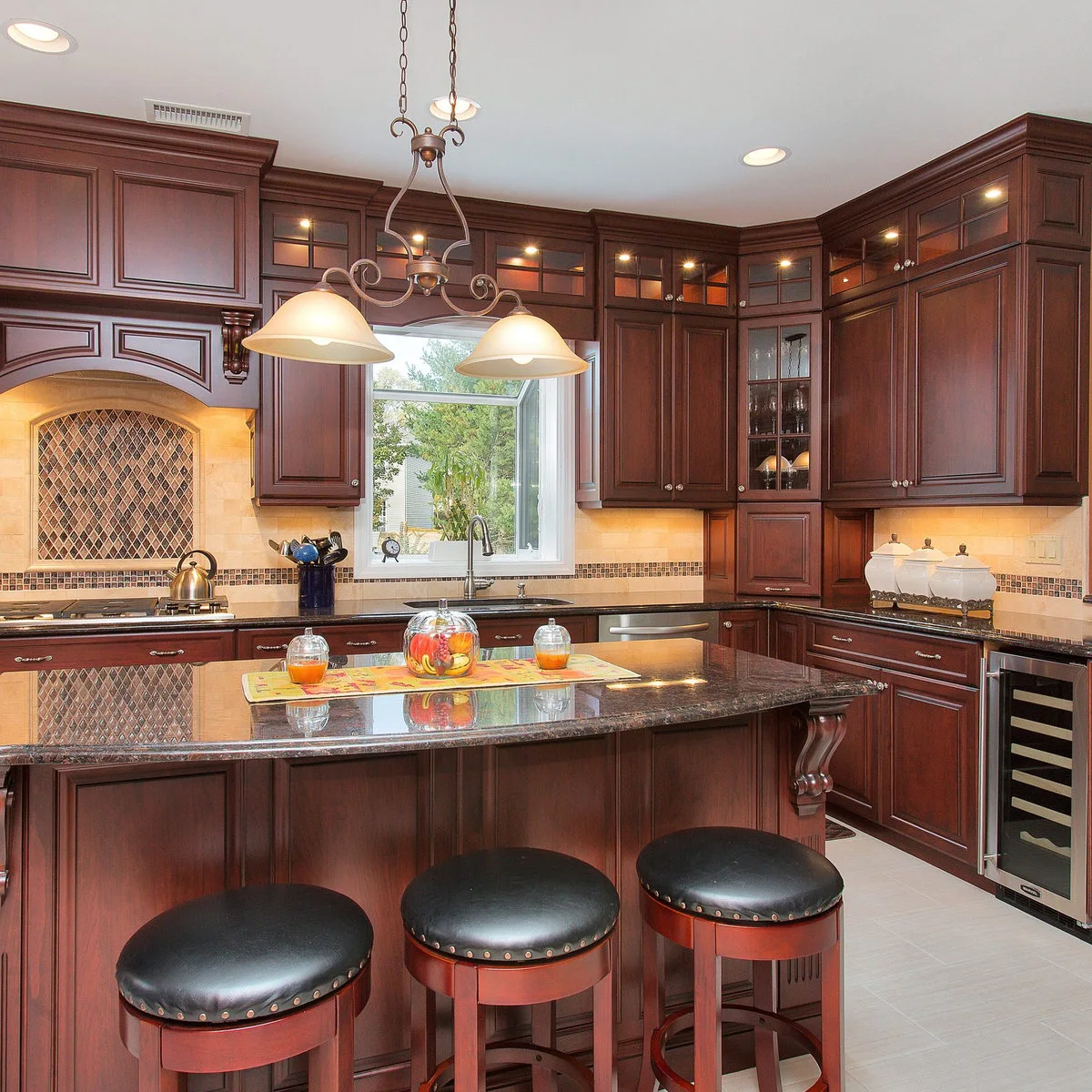 Traditional dark wooden kitchen with an angled glazed cupboard at the wall corner