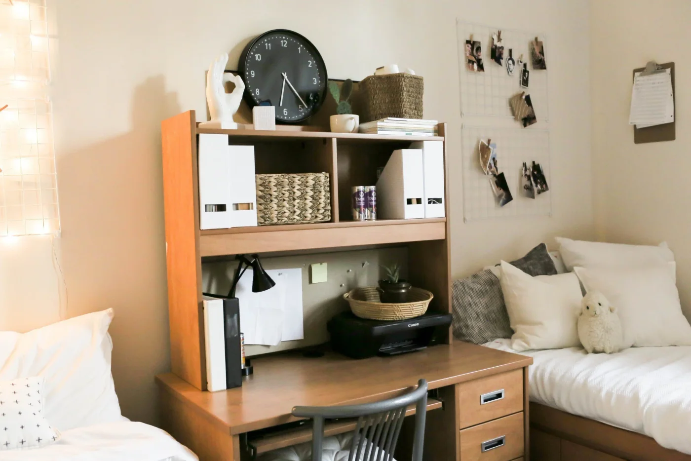 Wood dorm desk hutch with white magazine files, woven basket, printer and small task lamp