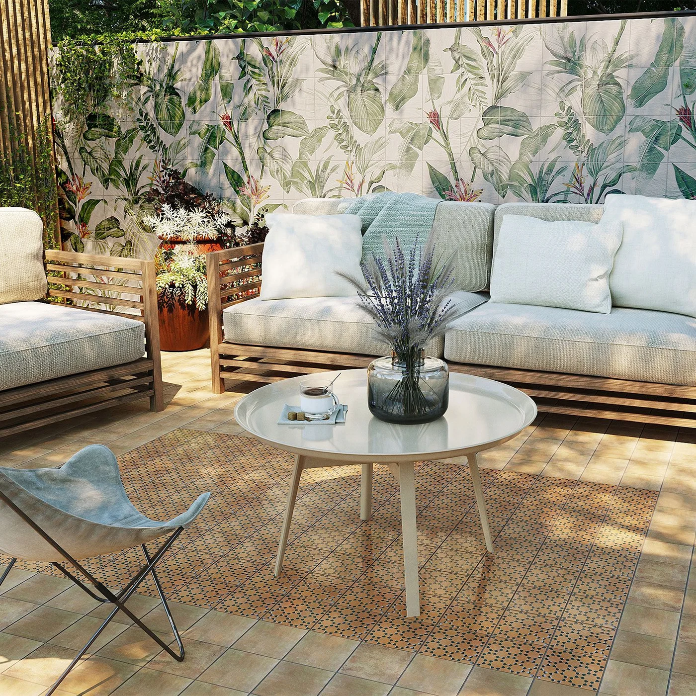 A pale botanical-patterned wall stands behind plain outdoor seating and a round coffee table