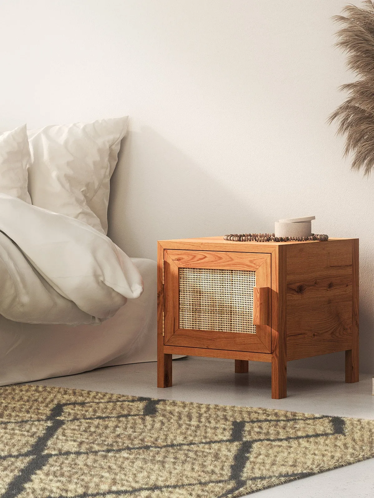 A warm timber nightstand includes a woven-front door beside pale bedding.