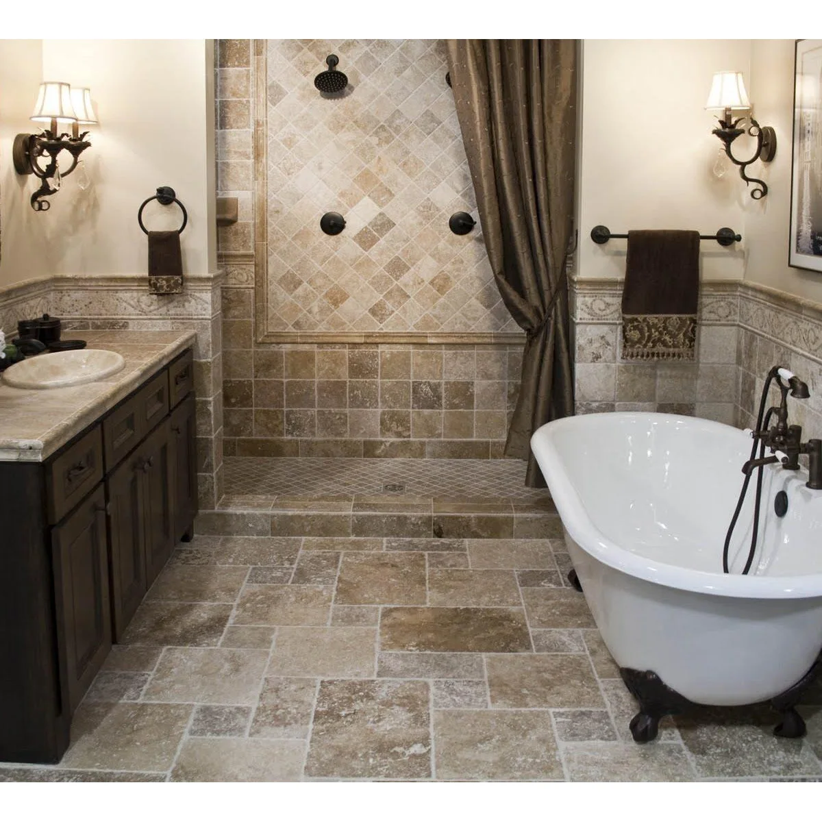 Rustic bathroom with warm rectangular floor tiles, diagonal shower tiles and a decorative wall band