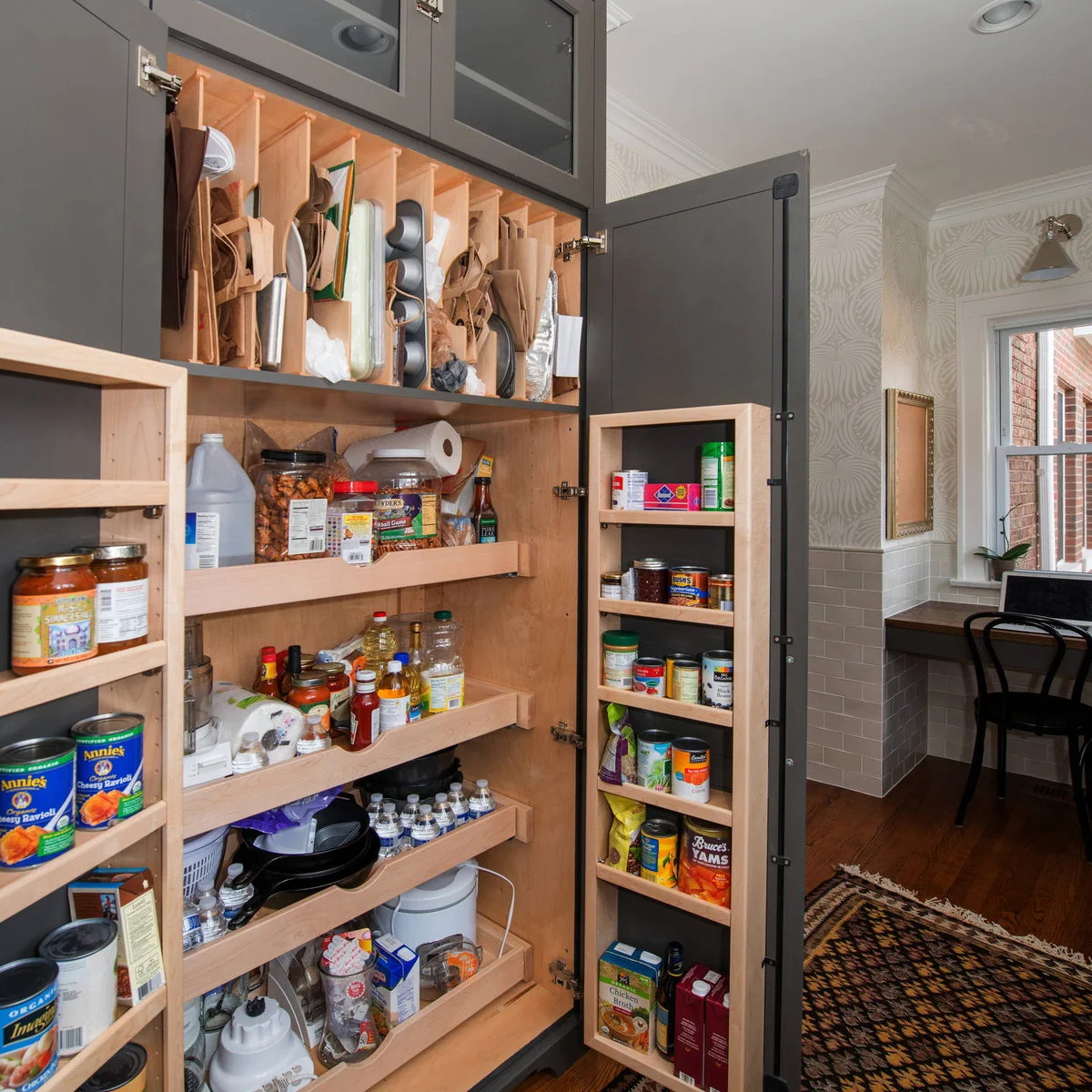Dark pantry cupboard with shallow door racks, deep shelves and vertical tray dividers