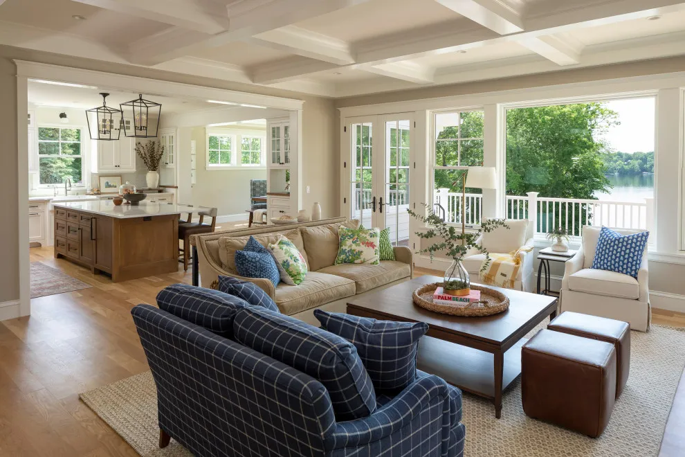 Pale sofa and blue patterned chairs around a rectangular timber coffee table