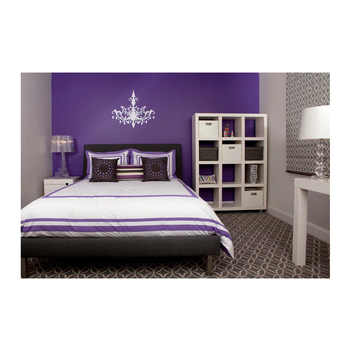 Purple teen bedroom with a white cube storage unit, patterned carpet and simple dark bed
