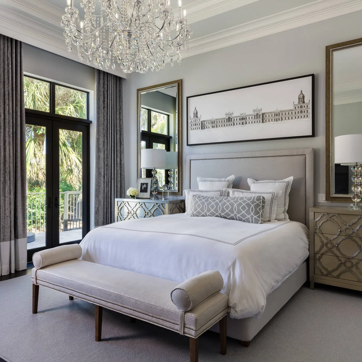 Wide architectural drawing above a pale upholstered bed with tall mirrors and matching bedside lamps.